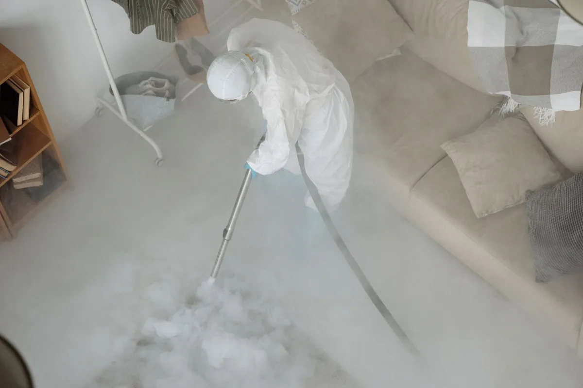 Biohazard cleanup technician in protective equipment, North Fork, CA